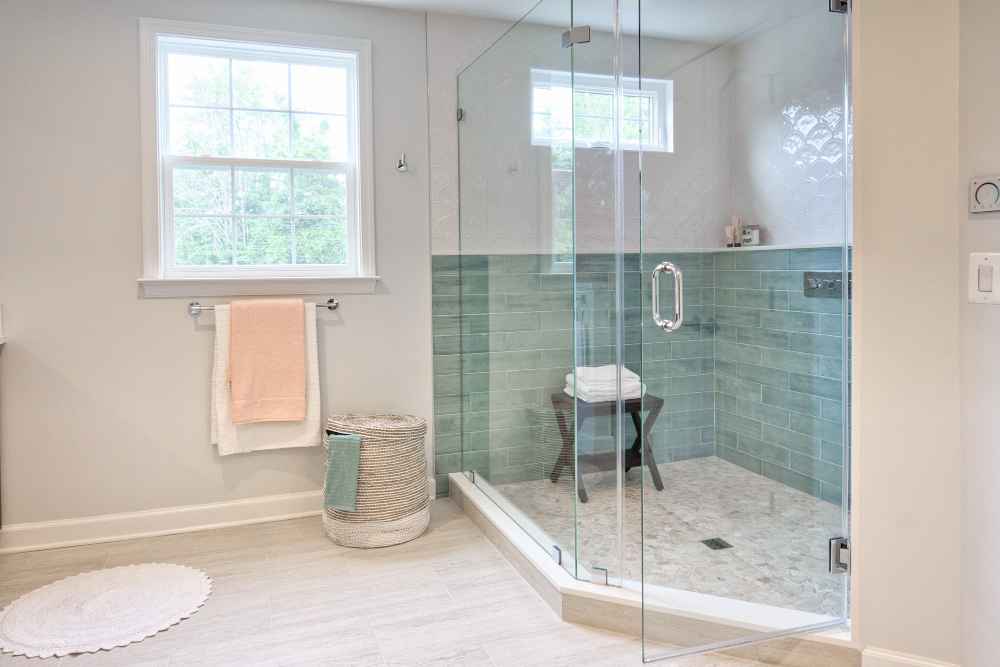 Refreshed shower area with waterproof peel & stick tiles giving a spa-like feel